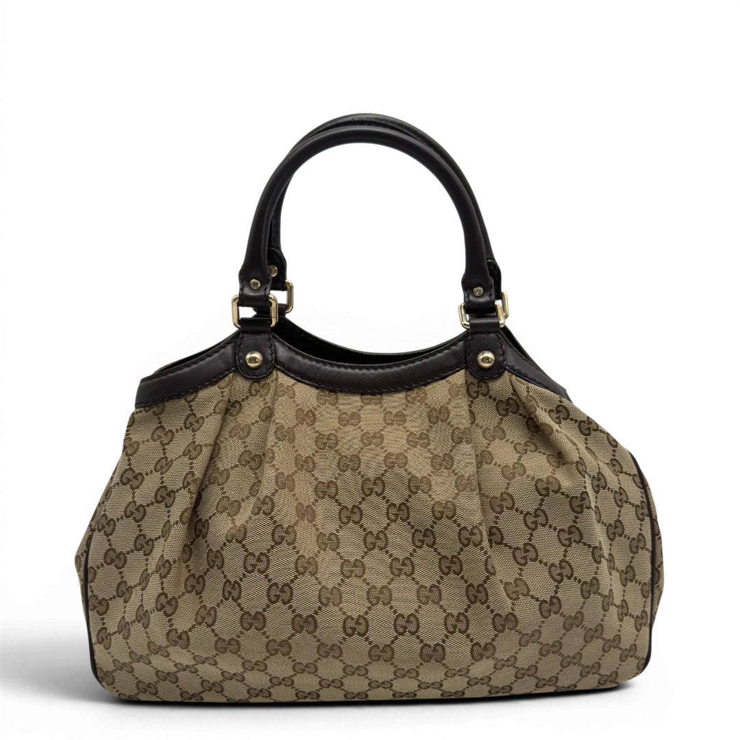 https://cdn.shopify.com/s/files/1/0564/9376/8855/files/GucciShopperSukeymonogrambeige7646.webp?v=1779408085