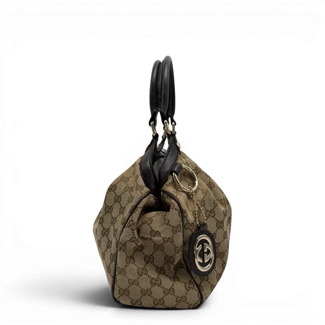 https://cdn.shopify.com/s/files/1/0564/9376/8855/files/GucciShopperSukeymonogrambeige7647.webp?v=1779408084