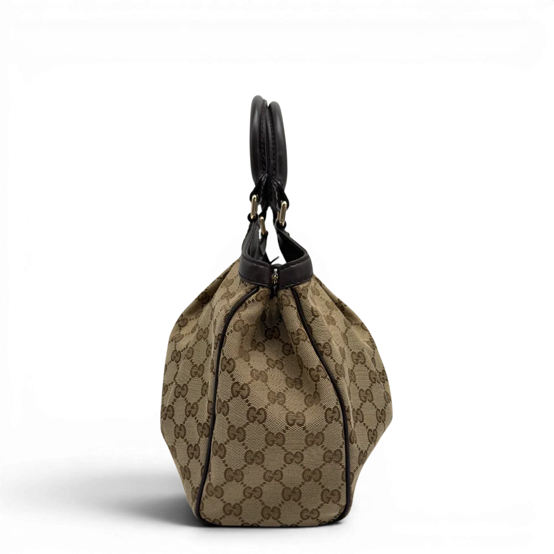 https://cdn.shopify.com/s/files/1/0564/9376/8855/files/GucciShopperSukeymonogrambeige7648.webp?v=1779408084