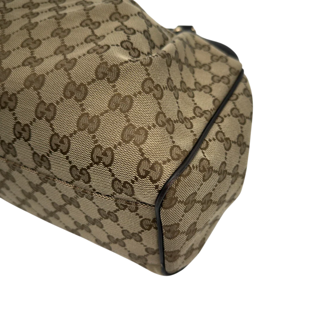 https://cdn.shopify.com/s/files/1/0564/9376/8855/files/GucciShopperSukeymonogrambeige7650.webp?v=1779408085