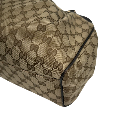 https://cdn.shopify.com/s/files/1/0564/9376/8855/files/GucciShopperSukeymonogrambeige7650.webp?v=1779408085