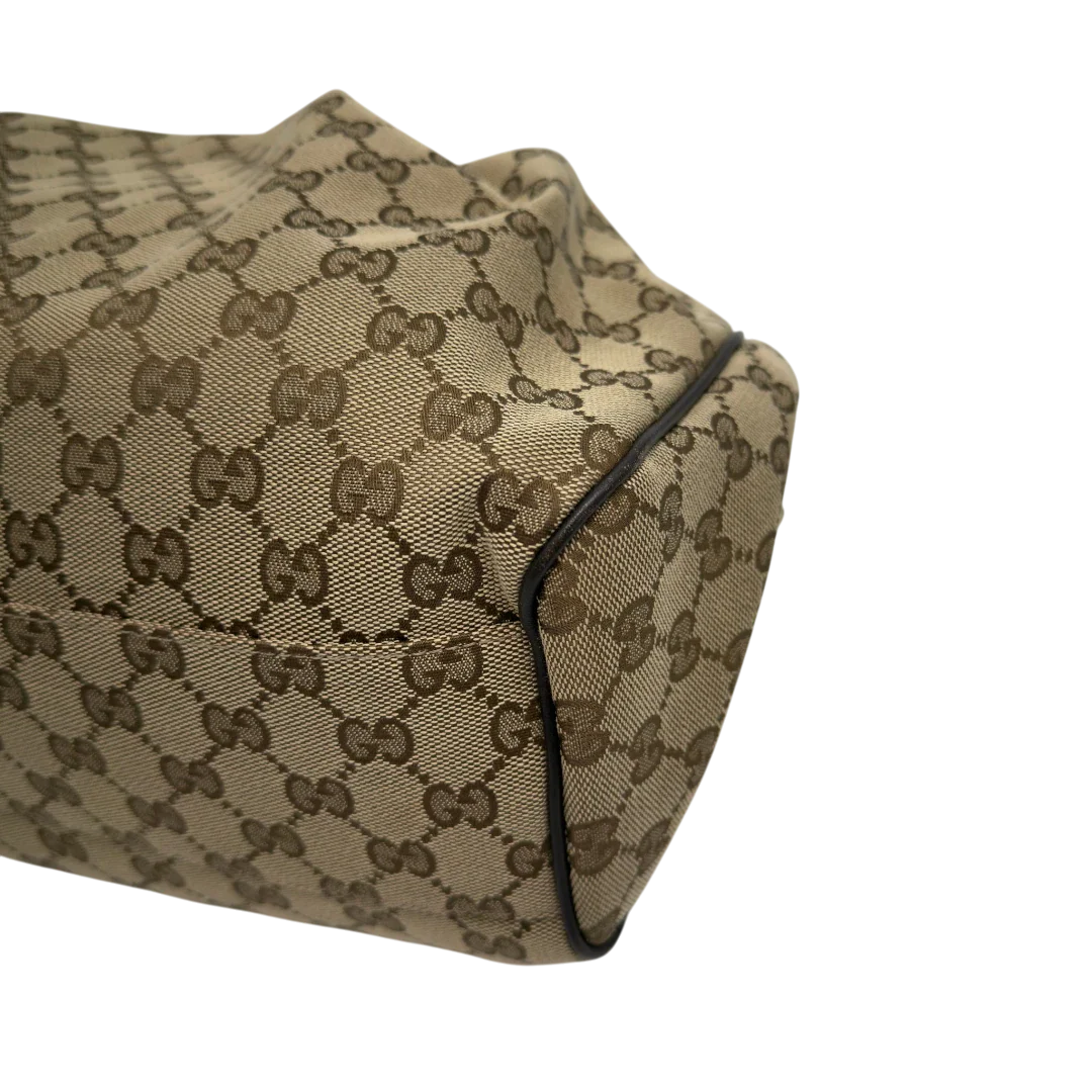 https://cdn.shopify.com/s/files/1/0564/9376/8855/files/GucciShopperSukeymonogrambeige7652.webp?v=1779408085