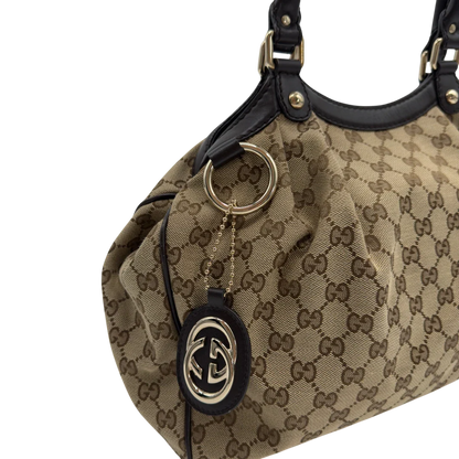 https://cdn.shopify.com/s/files/1/0564/9376/8855/files/GucciShopperSukeymonogrambeige7655.webp?v=1779408085