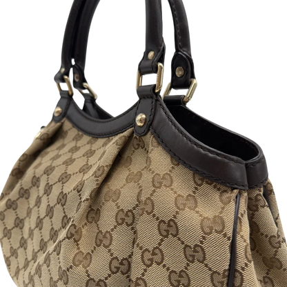 https://cdn.shopify.com/s/files/1/0564/9376/8855/files/GucciShopperSukeymonogrambeige7657.webp?v=1779408085