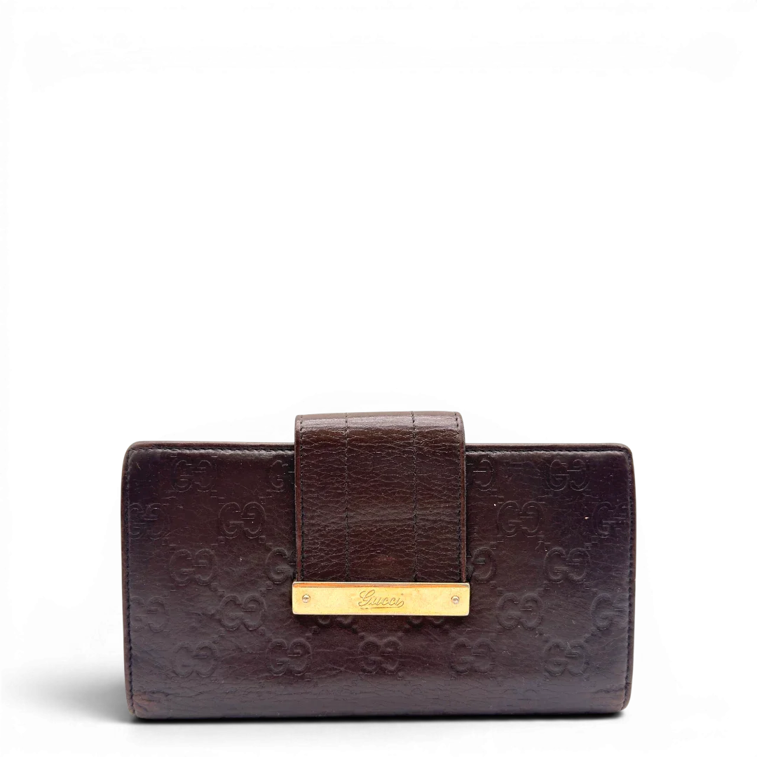 https://cdn.shopify.com/s/files/1/0564/9376/8855/files/Gucci_Geldbeutel_Bifold_langlich_aus_Leder_monogram_dunkelbraun_1.webp?v=1784242159