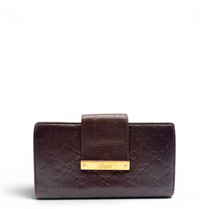 https://cdn.shopify.com/s/files/1/0564/9376/8855/files/Gucci_Geldbeutel_Bifold_langlich_aus_Leder_monogram_dunkelbraun_1.webp?v=1784242159