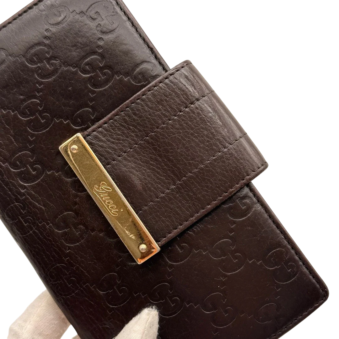 https://cdn.shopify.com/s/files/1/0564/9376/8855/files/Gucci_Geldbeutel_Bifold_langlich_aus_Leder_monogram_dunkelbraun_10.webp?v=1784242159