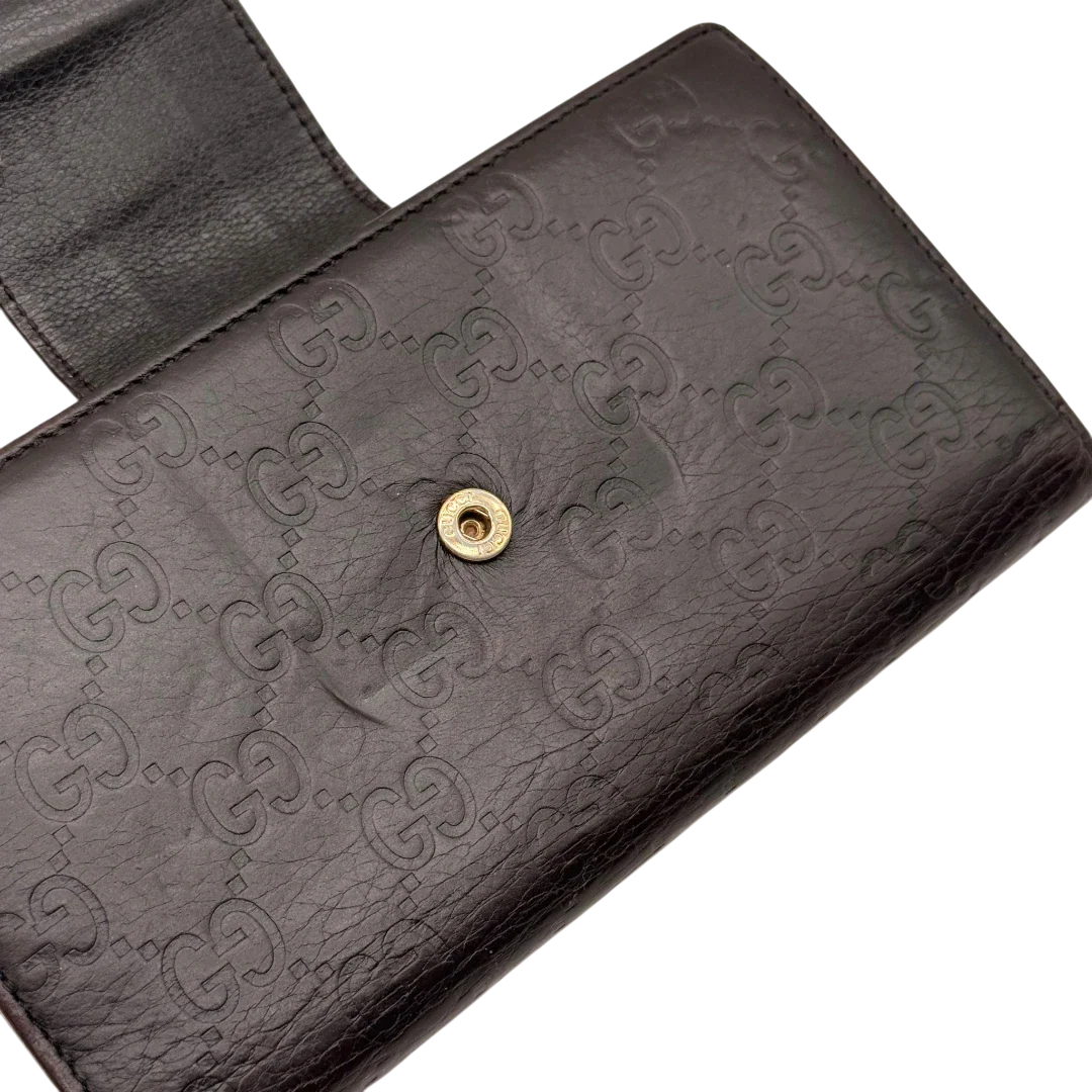 https://cdn.shopify.com/s/files/1/0564/9376/8855/files/Gucci_Geldbeutel_Bifold_langlich_aus_Leder_monogram_dunkelbraun_13.webp?v=1784242159