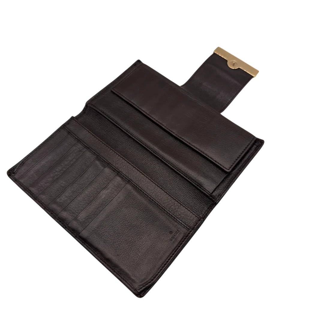 https://cdn.shopify.com/s/files/1/0564/9376/8855/files/Gucci_Geldbeutel_Bifold_langlich_aus_Leder_monogram_dunkelbraun_16.webp?v=1784242159