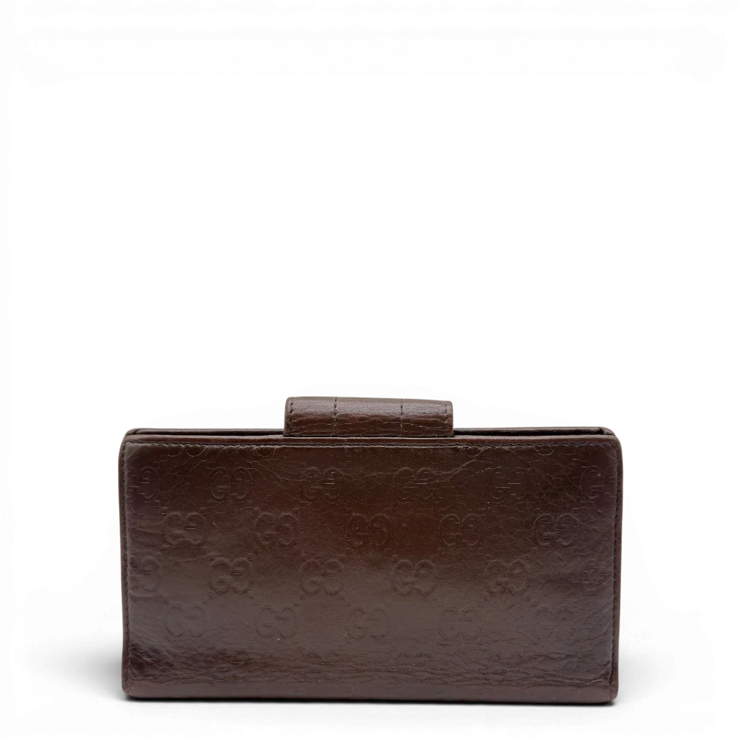 https://cdn.shopify.com/s/files/1/0564/9376/8855/files/Gucci_Geldbeutel_Bifold_langlich_aus_Leder_monogram_dunkelbraun_2.webp?v=1784242159