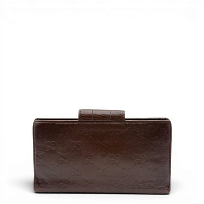 https://cdn.shopify.com/s/files/1/0564/9376/8855/files/Gucci_Geldbeutel_Bifold_langlich_aus_Leder_monogram_dunkelbraun_2.webp?v=1784242159