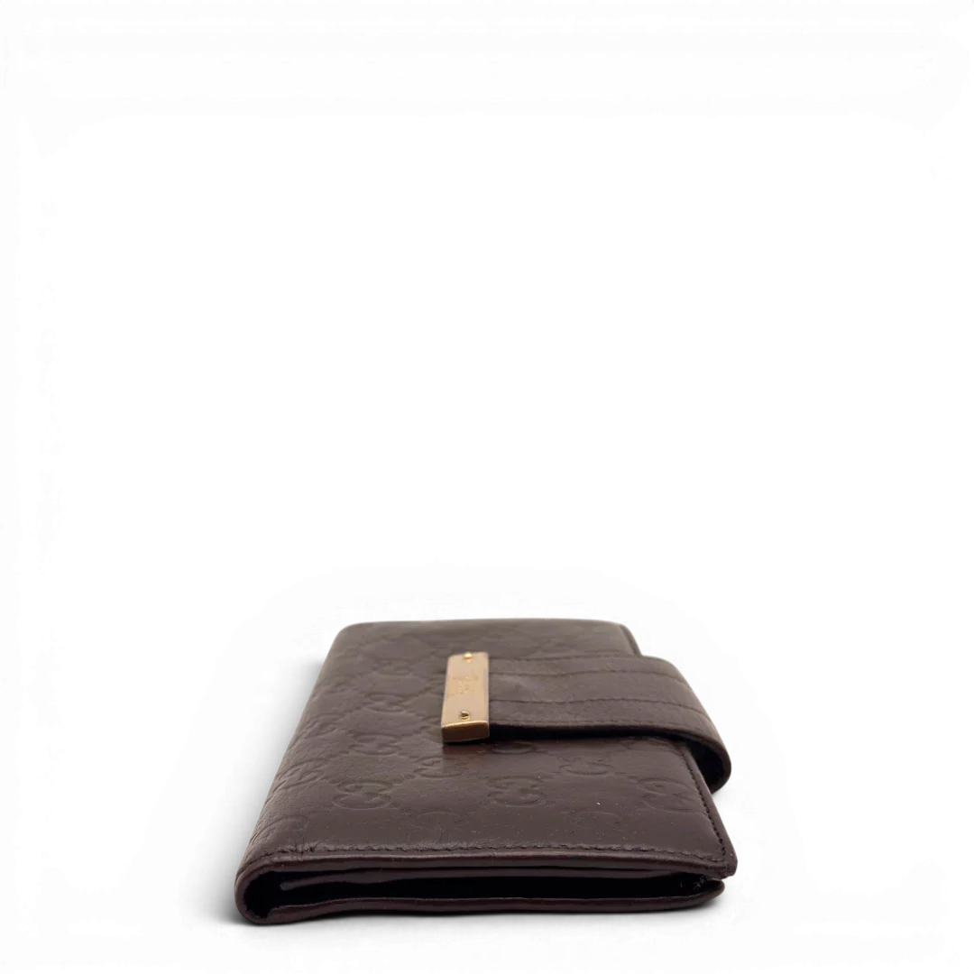 https://cdn.shopify.com/s/files/1/0564/9376/8855/files/Gucci_Geldbeutel_Bifold_langlich_aus_Leder_monogram_dunkelbraun_4.webp?v=1784242158