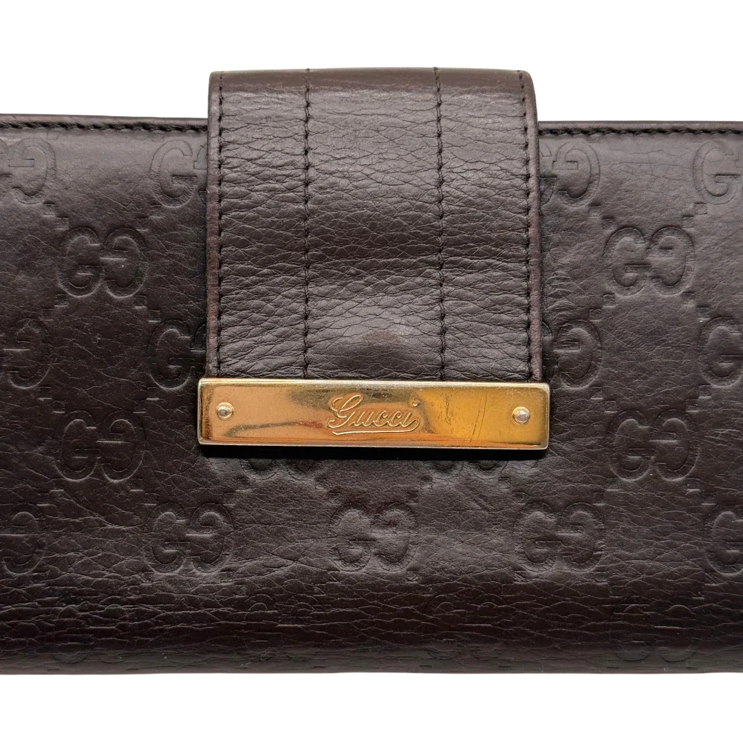 https://cdn.shopify.com/s/files/1/0564/9376/8855/files/Gucci_Geldbeutel_Bifold_langlich_aus_Leder_monogram_dunkelbraun_6.webp?v=1784242159