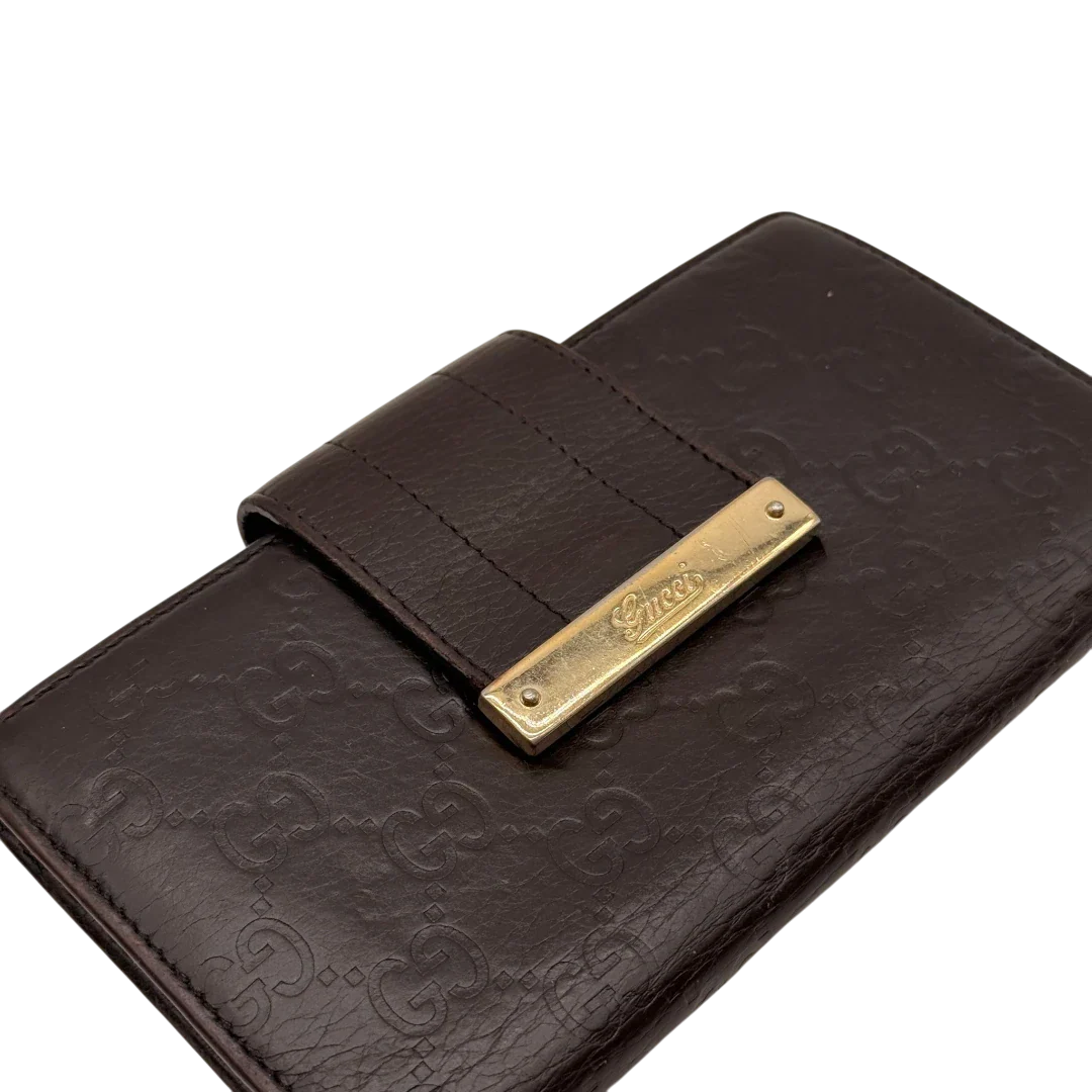 https://cdn.shopify.com/s/files/1/0564/9376/8855/files/Gucci_Geldbeutel_Bifold_langlich_aus_Leder_monogram_dunkelbraun_7.webp?v=1784242159