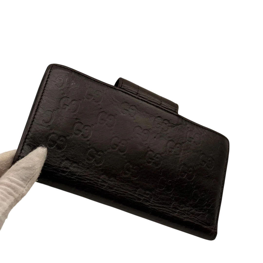 https://cdn.shopify.com/s/files/1/0564/9376/8855/files/Gucci_Geldbeutel_Bifold_langlich_aus_Leder_monogram_dunkelbraun_8.webp?v=1784242159