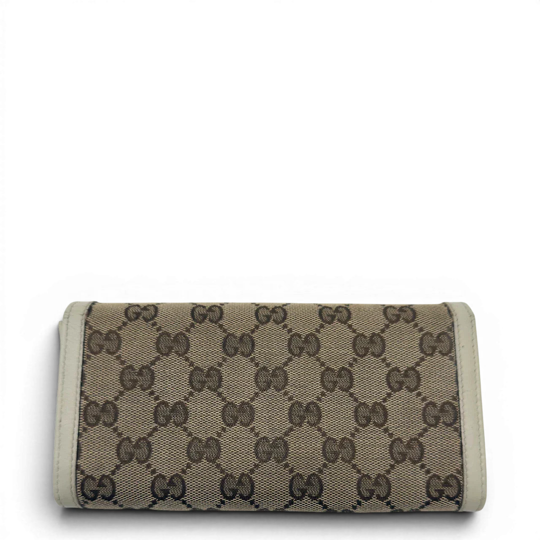 https://cdn.shopify.com/s/files/1/0564/9376/8855/files/Gucci_Geldbeutel_GG_langlich_monogram_beige_2.webp?v=1783513044