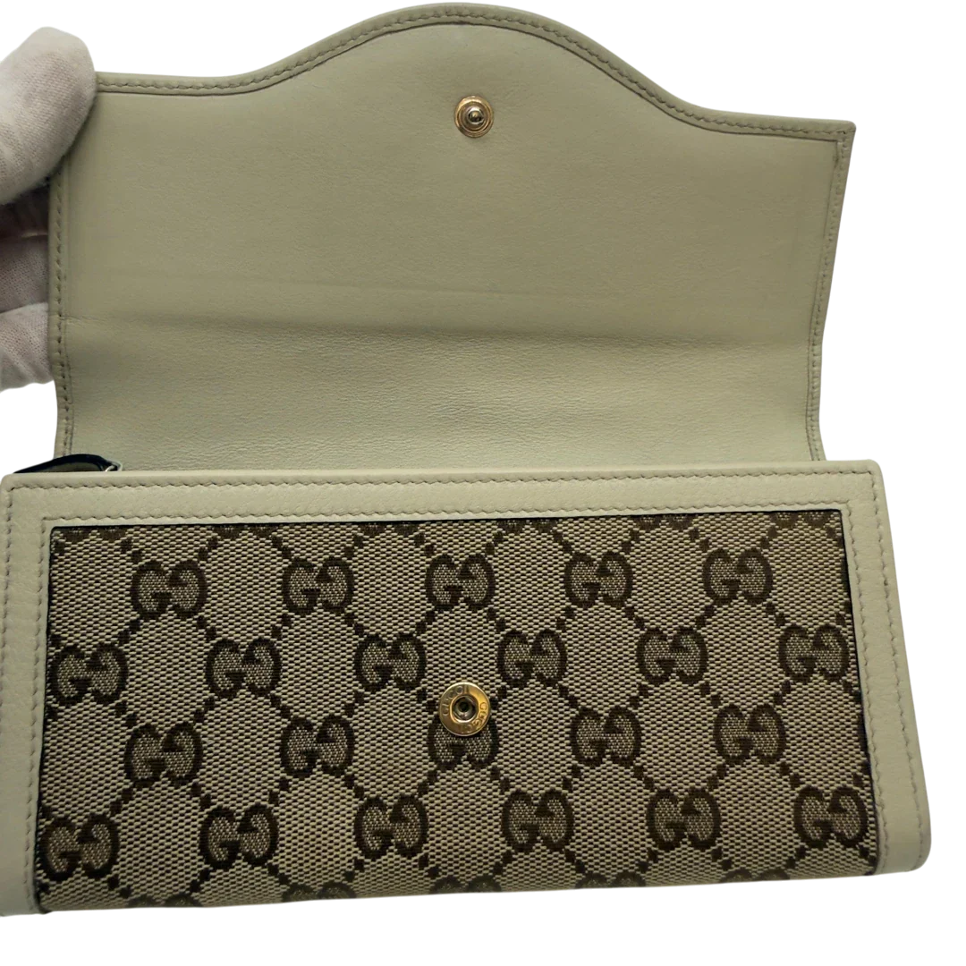 https://cdn.shopify.com/s/files/1/0564/9376/8855/files/Gucci_Geldbeutel_GG_langlich_monogram_beige_8.webp?v=1783513045