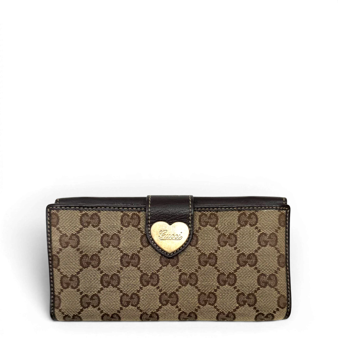 https://cdn.shopify.com/s/files/1/0564/9376/8855/files/Gucci_Geldbeutel_Heart_Continental_langlich_monogram_beige_1.webp?v=1783513751