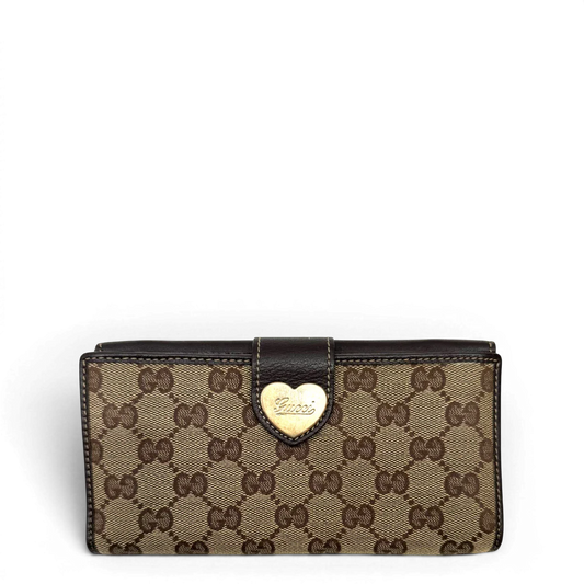 https://cdn.shopify.com/s/files/1/0564/9376/8855/files/Gucci_Geldbeutel_Heart_Continental_langlich_monogram_beige_1.webp?v=1783513751