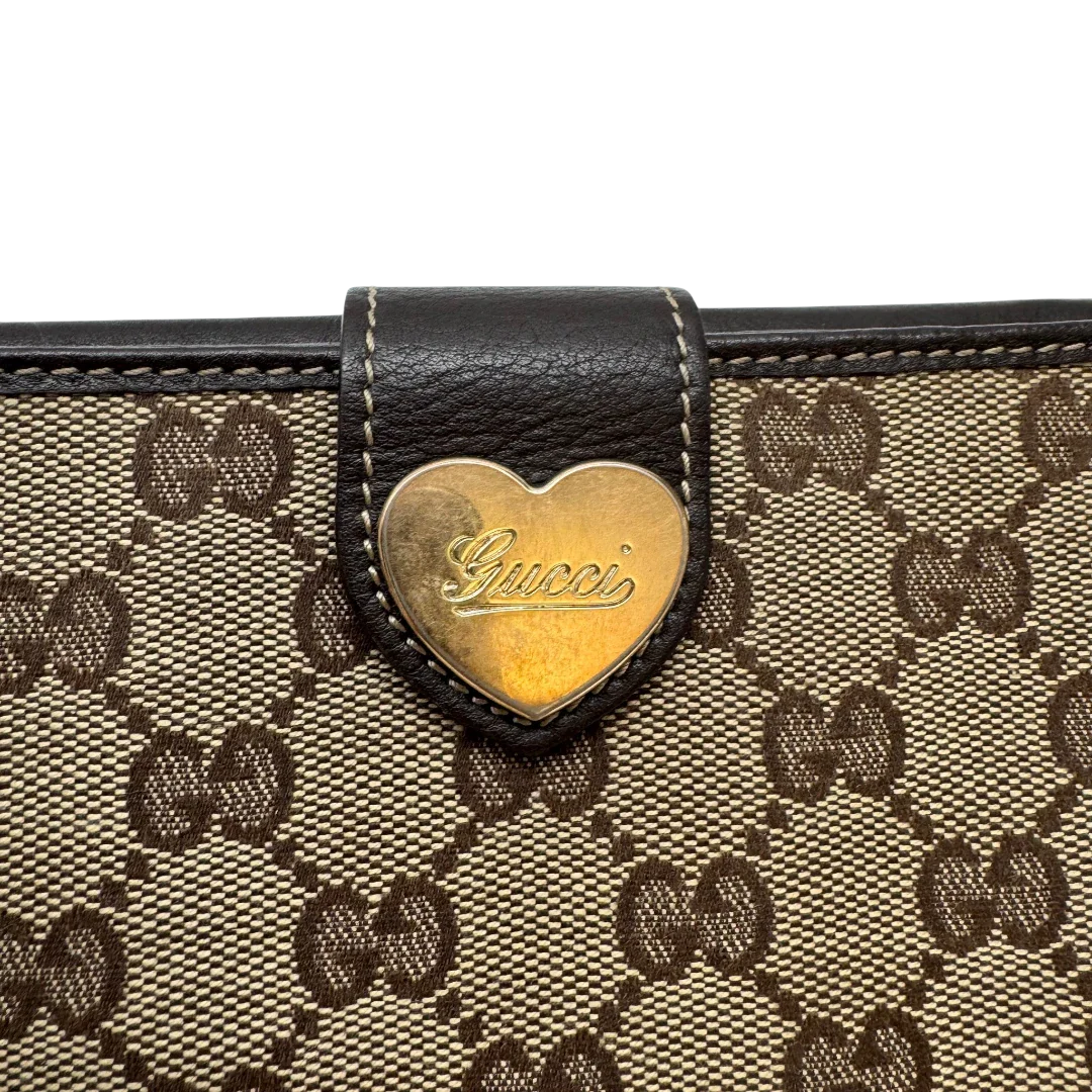 https://cdn.shopify.com/s/files/1/0564/9376/8855/files/Gucci_Geldbeutel_Heart_Continental_langlich_monogram_beige_5.webp?v=1783513751