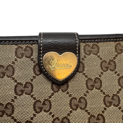 https://cdn.shopify.com/s/files/1/0564/9376/8855/files/Gucci_Geldbeutel_Heart_Continental_langlich_monogram_beige_5.webp?v=1783513751
