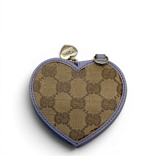 https://cdn.shopify.com/s/files/1/0564/9376/8855/files/Gucci_Geldbeutel_Herzformig_aus_Leder_braun_vintage_GG7207.webp?v=1779896091