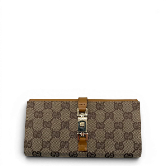 https://cdn.shopify.com/s/files/1/0564/9376/8855/files/Gucci_Geldbeutel_Jackie_langlich_monogram_beige_vintage_GG8157.webp?v=1781084188
