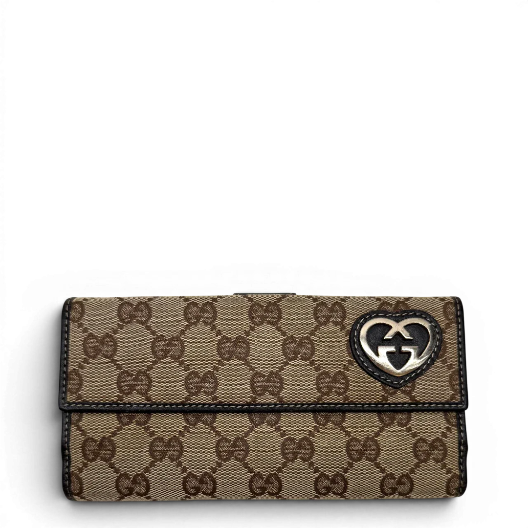 https://cdn.shopify.com/s/files/1/0564/9376/8855/files/Gucci_Geldbeutel_Lovely_Heart_langlich_monogram_beige_1.webp?v=1783513516