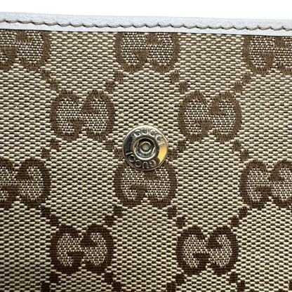 https://cdn.shopify.com/s/files/1/0564/9376/8855/files/Gucci_Geldbeutel_Lovely_Heart_monogram_beige_5.webp?v=1784270175