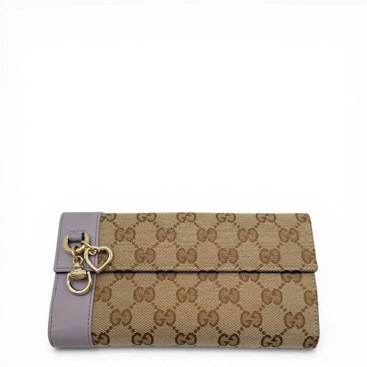https://cdn.shopify.com/s/files/1/0564/9376/8855/files/Gucci_Geldbeutel_langlich_Trifold_monogram_beige_vintage_GG4058.webp?v=1775733031