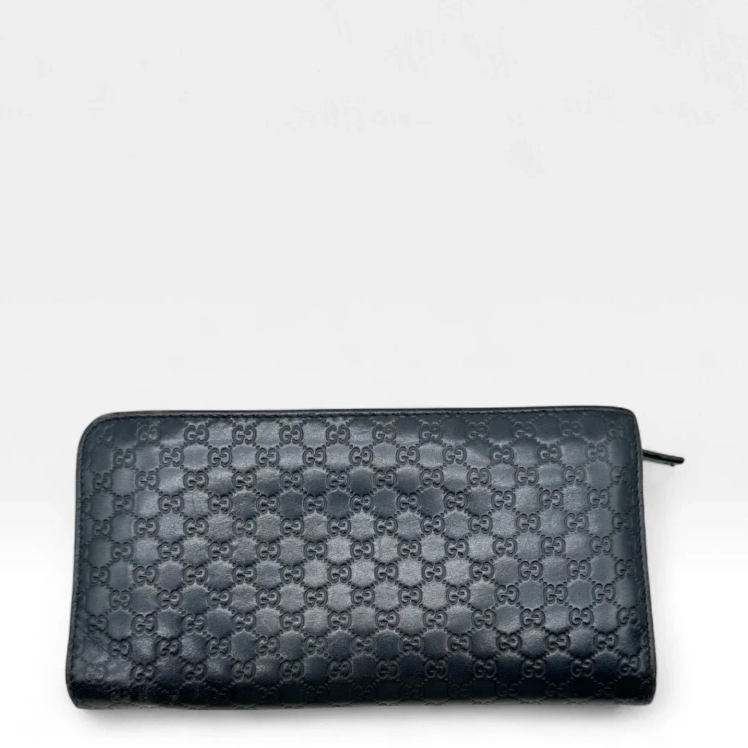 https://cdn.shopify.com/s/files/1/0564/9376/8855/files/Gucci_Geldbeutel_langlich_aus_Leder_monogram_dunkelblau_vintage_GG_wallet7962.webp?v=1758633154