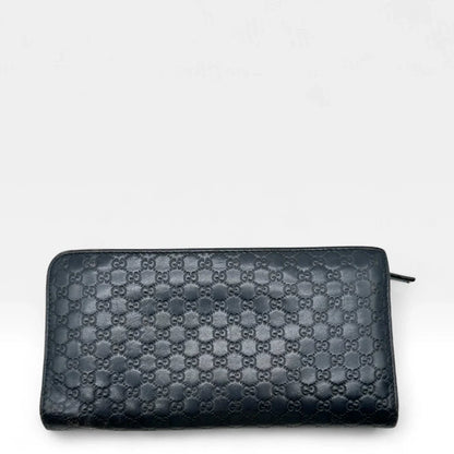 https://cdn.shopify.com/s/files/1/0564/9376/8855/files/Gucci_Geldbeutel_langlich_aus_Leder_monogram_dunkelblau_vintage_GG_wallet7962.webp?v=1758633154