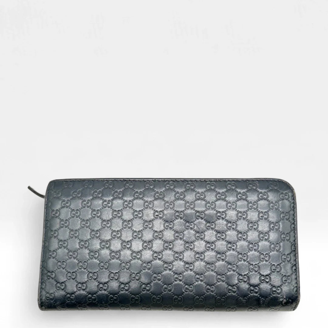 https://cdn.shopify.com/s/files/1/0564/9376/8855/files/Gucci_Geldbeutel_langlich_aus_Leder_monogram_dunkelblau_vintage_GG_wallet7963.webp?v=1758633154