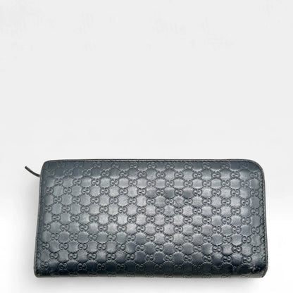 https://cdn.shopify.com/s/files/1/0564/9376/8855/files/Gucci_Geldbeutel_langlich_aus_Leder_monogram_dunkelblau_vintage_GG_wallet7963.webp?v=1758633154