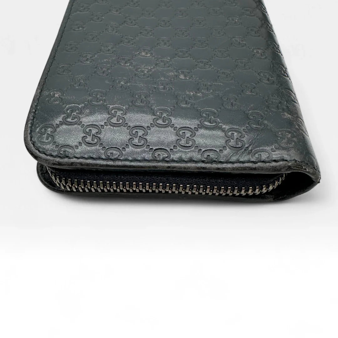 https://cdn.shopify.com/s/files/1/0564/9376/8855/files/Gucci_Geldbeutel_langlich_aus_Leder_monogram_dunkelblau_vintage_GG_wallet7967.webp?v=1758633154