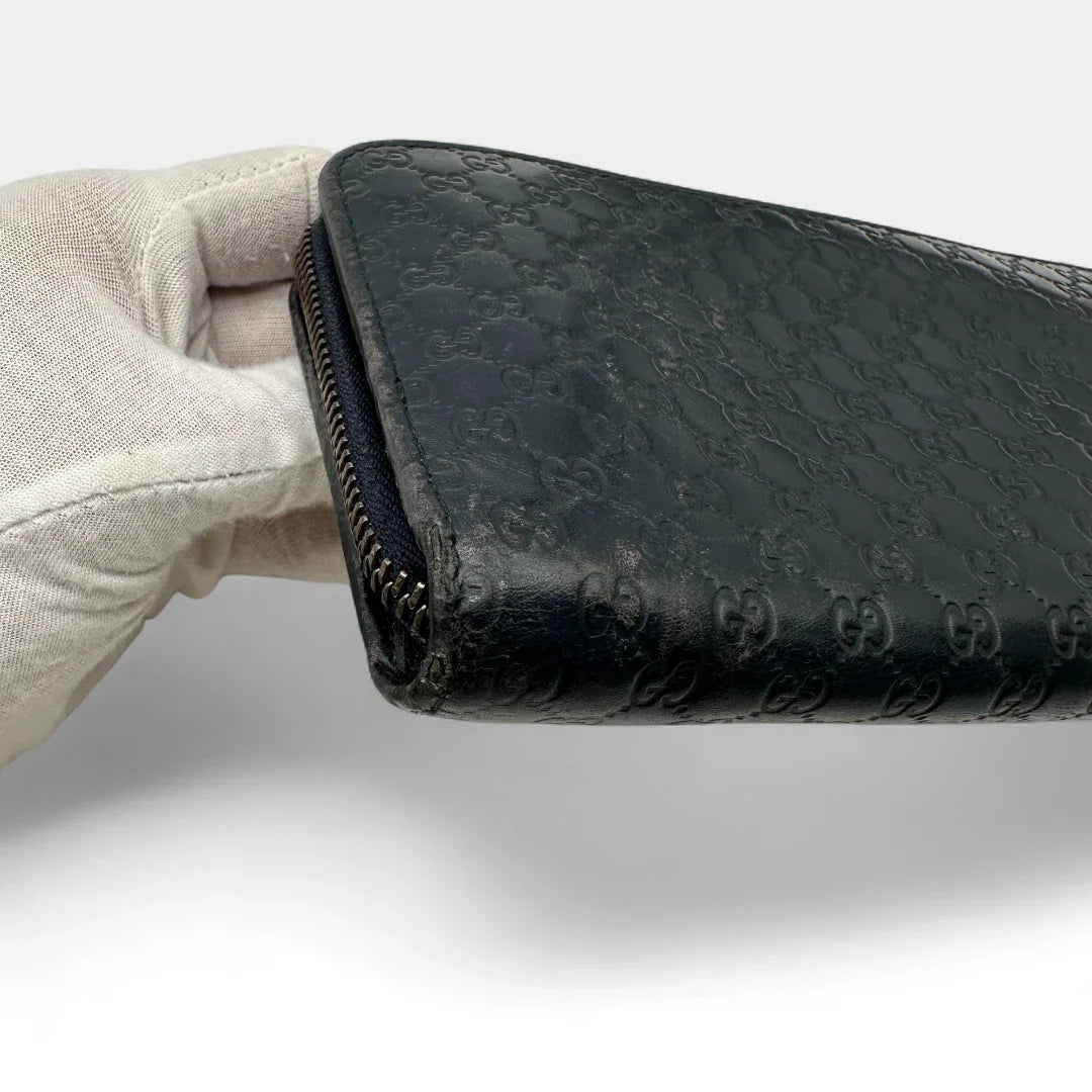 https://cdn.shopify.com/s/files/1/0564/9376/8855/files/Gucci_Geldbeutel_langlich_aus_Leder_monogram_dunkelblau_vintage_GG_wallet7970.webp?v=1758633154