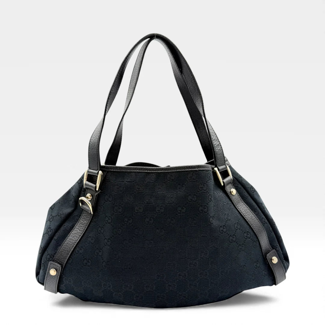 https://cdn.shopify.com/s/files/1/0564/9376/8855/files/Gucci_Handtasche_Abbey_Shopper_monogram_schwarz_vintage_GG4501.webp?v=1764895684