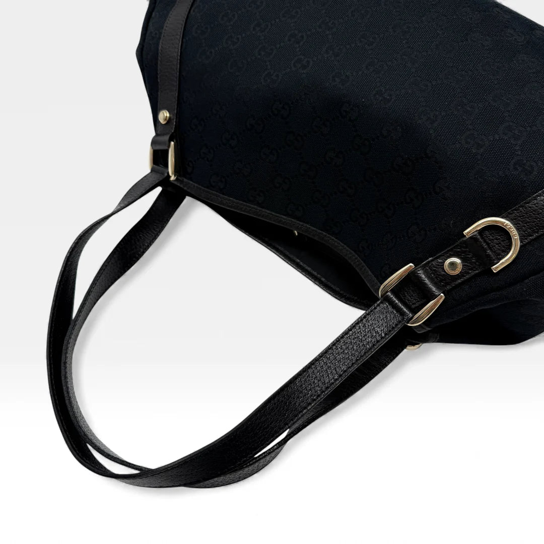 https://cdn.shopify.com/s/files/1/0564/9376/8855/files/Gucci_Handtasche_Abbey_Shopper_monogram_schwarz_vintage_GG4519.webp?v=1764895697