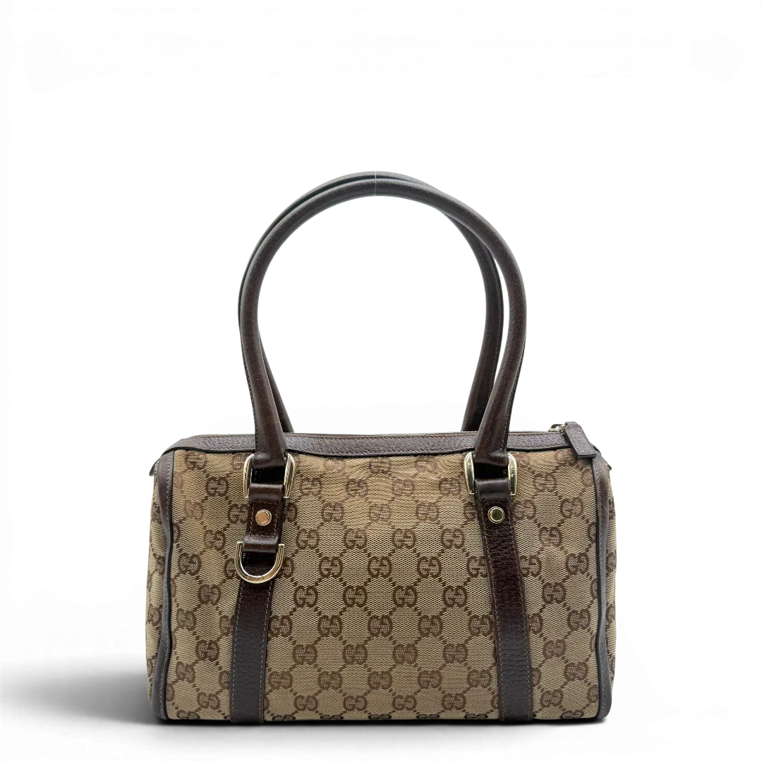 https://cdn.shopify.com/s/files/1/0564/9376/8855/files/Gucci_Handtasche_Abbey_langlich_monogram_beige_2.webp?v=1781712916