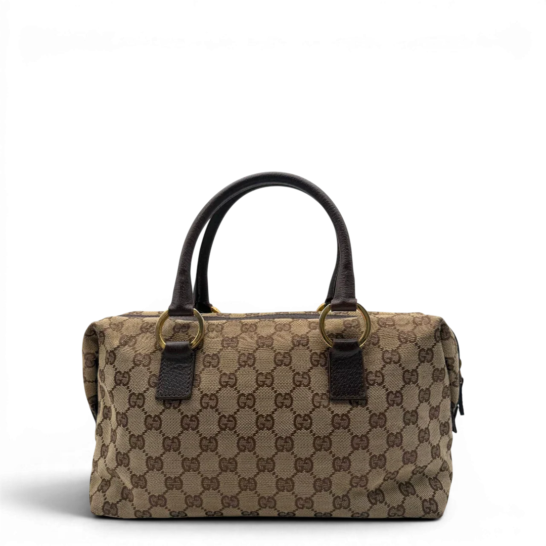 https://cdn.shopify.com/s/files/1/0564/9376/8855/files/Gucci_Handtasche_Balthus_langlich_monogram_beige_vintage_GG7441.webp?v=1779964370