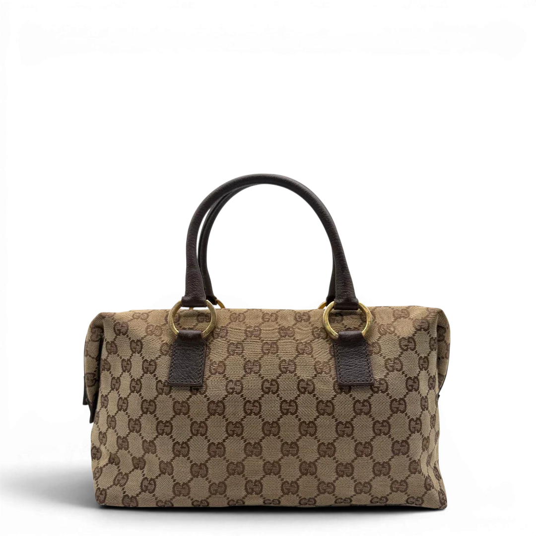 https://cdn.shopify.com/s/files/1/0564/9376/8855/files/Gucci_Handtasche_Balthus_langlich_monogram_beige_vintage_GG7443.webp?v=1779964370