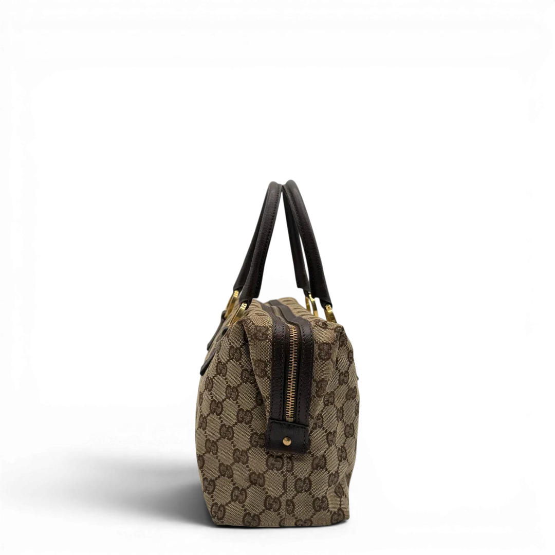 https://cdn.shopify.com/s/files/1/0564/9376/8855/files/Gucci_Handtasche_Balthus_langlich_monogram_beige_vintage_GG7445.webp?v=1779964370