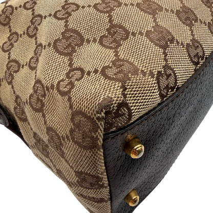 https://cdn.shopify.com/s/files/1/0564/9376/8855/files/Gucci_Handtasche_Balthus_langlich_monogram_beige_vintage_GG7447.webp?v=1779964370