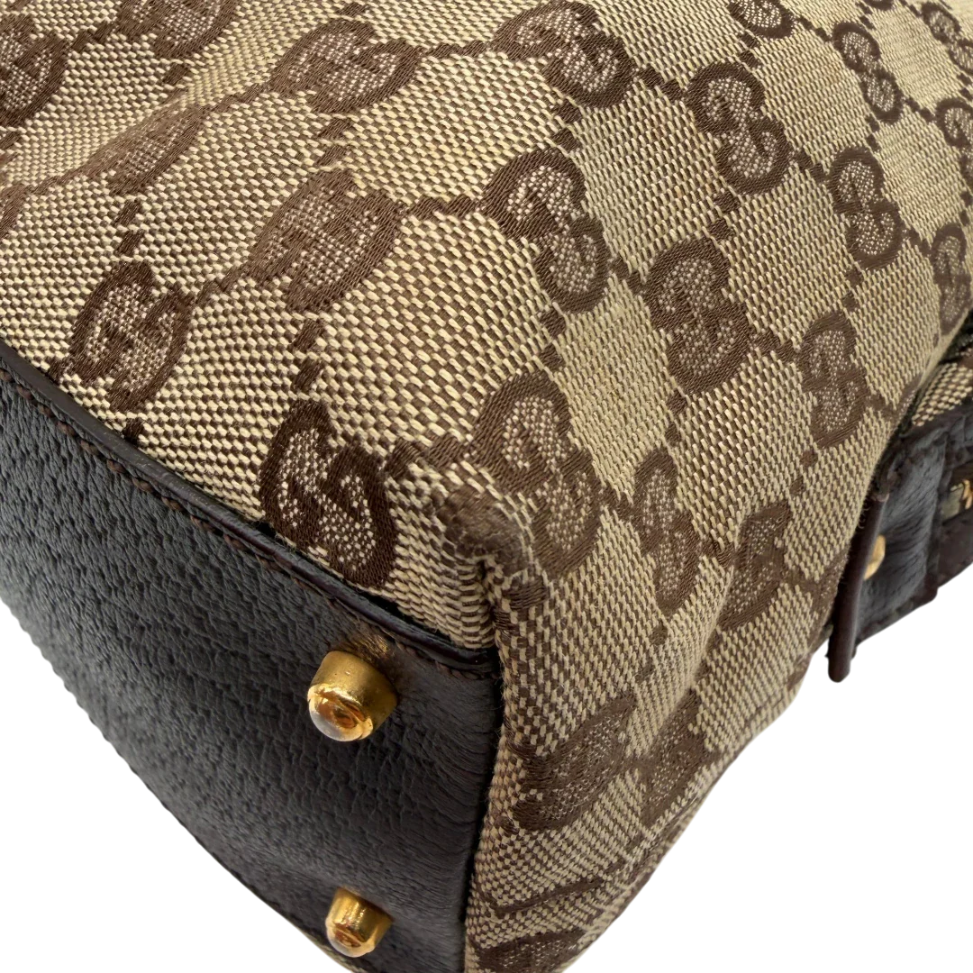 https://cdn.shopify.com/s/files/1/0564/9376/8855/files/Gucci_Handtasche_Balthus_langlich_monogram_beige_vintage_GG7449.webp?v=1779964370