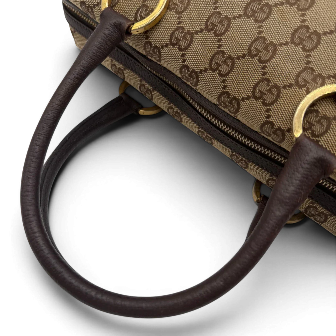 https://cdn.shopify.com/s/files/1/0564/9376/8855/files/Gucci_Handtasche_Balthus_langlich_monogram_beige_vintage_GG7451.webp?v=1779964370