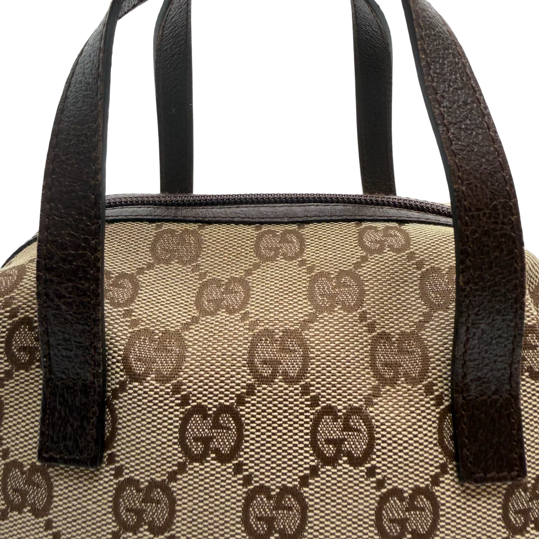 https://cdn.shopify.com/s/files/1/0564/9376/8855/files/Gucci_Handtasche_Balthus_monogram_beige_vintage_GG_0183.webp?v=1771409218