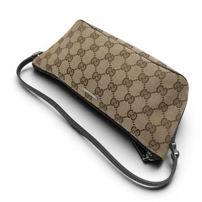 https://cdn.shopify.com/s/files/1/0564/9376/8855/files/Gucci_Handtasche_Boat_Baguette_monogram_beige_10.webp?v=1782904853