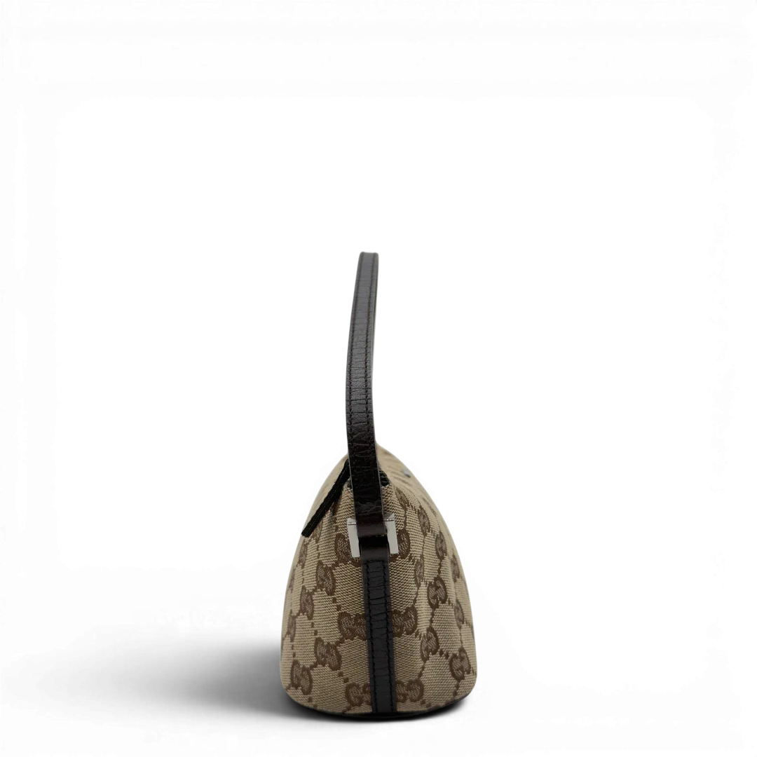 https://cdn.shopify.com/s/files/1/0564/9376/8855/files/Gucci_Handtasche_Boat_Baguette_monogram_beige_3.webp?v=1782904853