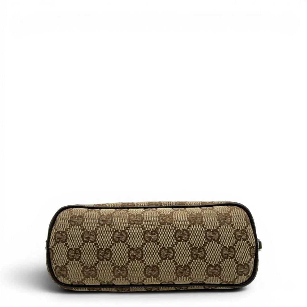 https://cdn.shopify.com/s/files/1/0564/9376/8855/files/Gucci_Handtasche_Boat_Baguette_monogram_beige_5.webp?v=1782904853