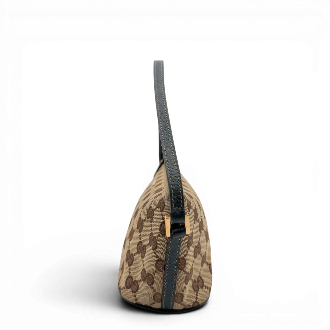 https://cdn.shopify.com/s/files/1/0564/9376/8855/files/Gucci_Handtasche_Boat_Baguette_monogram_beige_vintage_GG7300.webp?v=1778683623